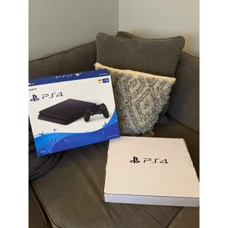 PS4 Barely Used Complete 500GB Console With One Controller Black In Original Packaging